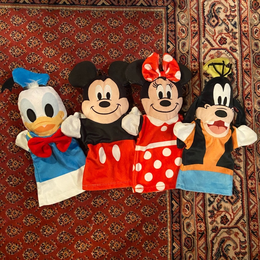 Three sets of Melissa & Doug puppets (12 puppets total)